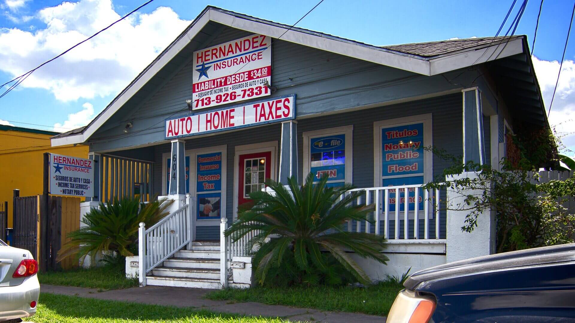 Small tax service office with signs offering loans, taxes, and financial services.